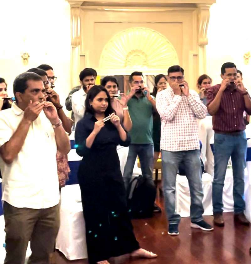 group activity with harmonicas for leaders